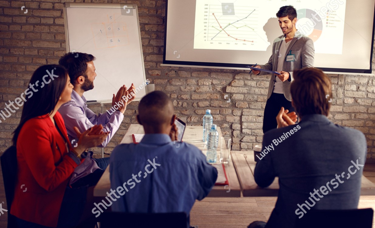 stock-photo-male-holding-business-presentation-about-success-in-business-644231788